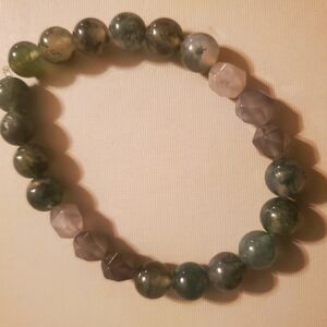 Handmade by my daughter. Beautiful green beaded bracelet.